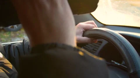 The driver drinks strong alcohol while driving. Drunk driving. Видео 320382400