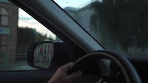 The driver drives a car through the evening city Vídeo Stock 292501856