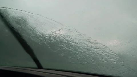 Driver Driving Car in Bad Rain Storm With Windshield Wipers on High Stock Footage 135367226
