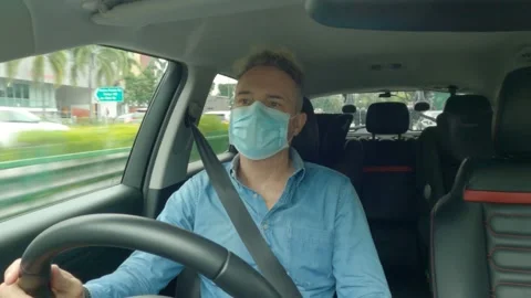 Driver Driving Car With On Mask Stock Footage