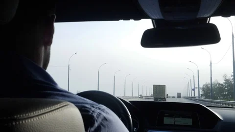 The driver is driving Stock Footage 95773768