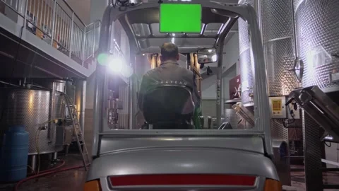 Driver driving a forklift moves through the territory of a winery. Stock Footage 268750605