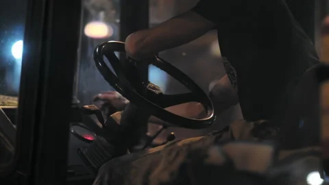 The driver is driving a road roller. Road repair in the city. Road roller cabin. Stock-Footage 153603251