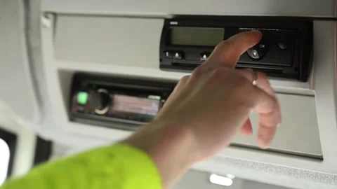 Driver ejects drivers card out of a digital tachograph Stock Footage 169090467