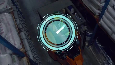 Driver engaging controls moving forklift down depot aisle clock HUD rotating Stock Footage 330564028