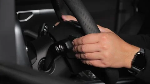  The driver examines the interior of a new car with a black interior. Stock Footage 278604027
