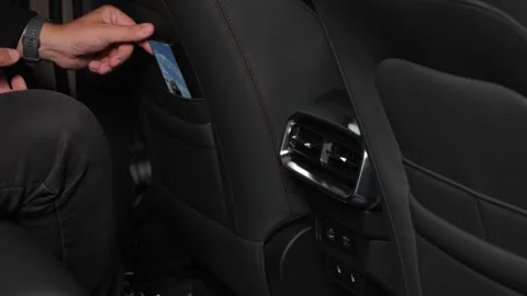  The driver examines the interior of a new car with a black interior. Stock Footage 278604032
