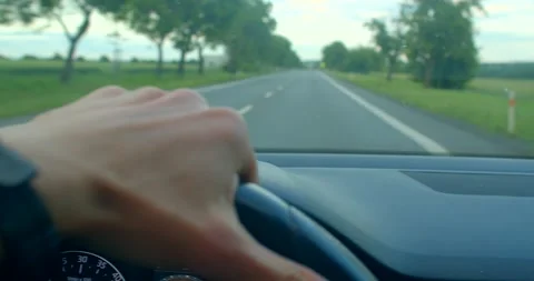 A driver explores diverse landscapes from highways to country roads Stock Footage 314347287