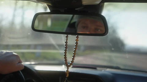 Driver Eyes Reflected in Rearview Mirror Inside Car Interior Stock Footage 327004517