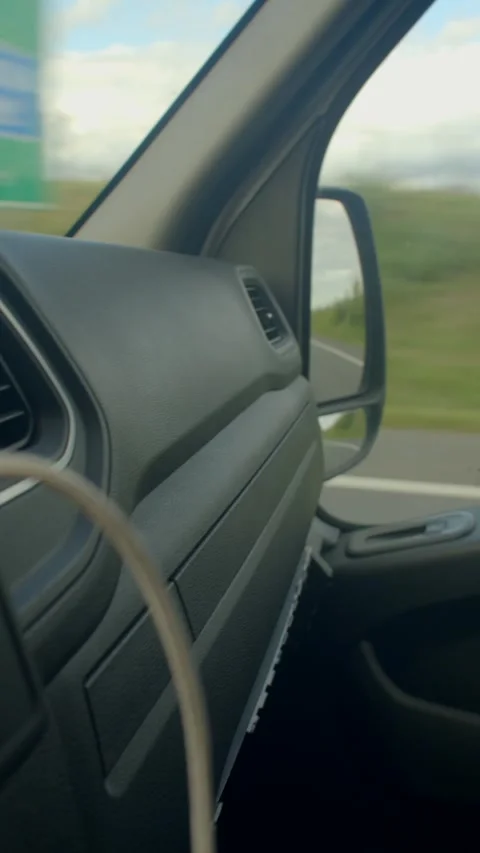 A driver faces challenges on the highway, showcasing tech and drama Stock Footage 317340666