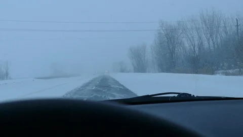 Driver filming in snowstorm with accident in front Stock Footage 103869357