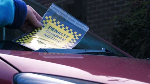 Driver finds parking ticket on windshield of car 스톡 동영상 332167761