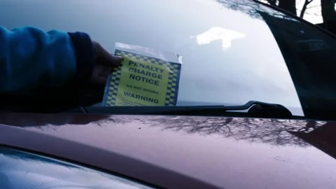 Driver finds parking ticket on windshield of car Stock Footage 334219395