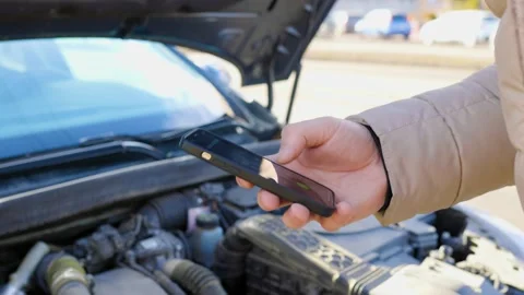 A driver frantically making a call for assistance Stock Footage 234691560
