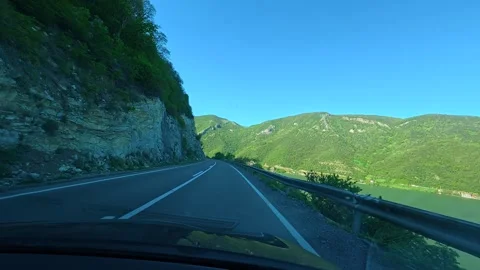 Driver glides through winding mountain pass. Balkan, Eastern Europe, POV Vídeo Stock 333349975