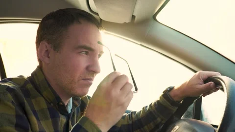 Driver goes blind from the bright sun while driving the car. poor visibility in Stock Footage 301681454