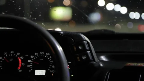 The driver goes through the city at night in rainy weather Stock Footage 90832553