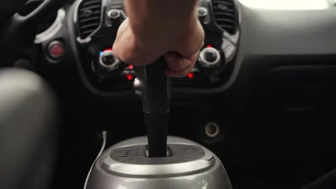 Driver Hand On Automatic Gear Shifter Stock Footage 334393749