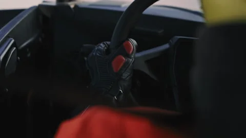 Driver hand on buggy steering wheel close up 動画素材 318947142