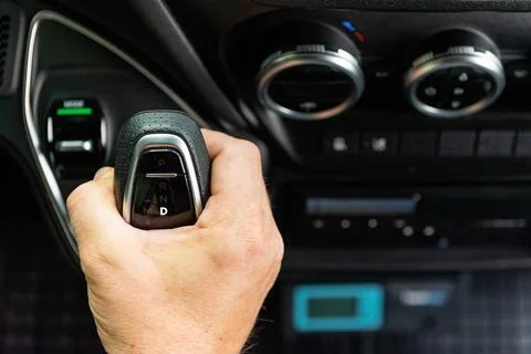 Driver hand pushing button on car dashboard 스톡 사진