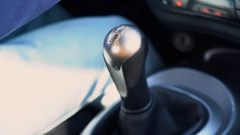 Driver hand shifting the manual gear in car close up. Male driving, changes gear Stock Footage
