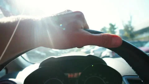 Driver hand on steering wheel of car in a traffic jam. Spending time waiting. Stock Footage 140739777