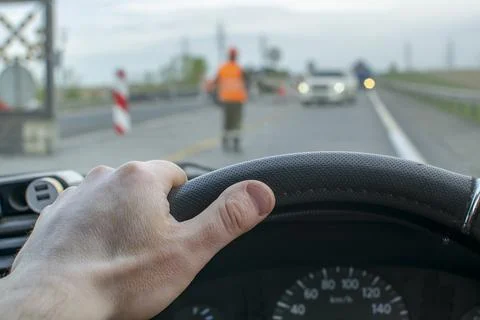 Driver hand is on the steering wheel Stock Photos