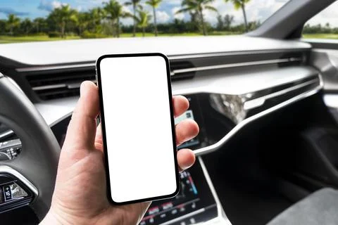 Driver hand using smartphone in car. Smartphone in a car use for Navigate o.. Stock Photos