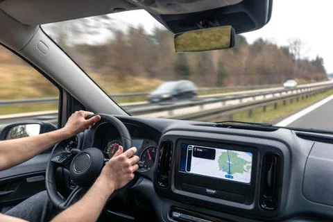 Driver Hands And Dashboard Navigation On Highway Road Fotos de archivo
