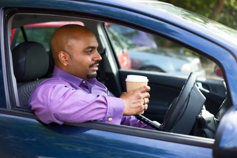 Driver having a coffee at a roadside carpark Stock Photos