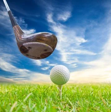 Driver hit golf ball on tee Stock Photos