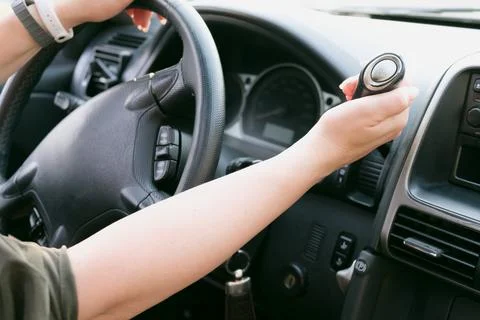 Driver hold on to the shift lever of the automatic transmission on the wheel Stock Photos