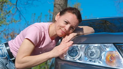 Driver hugs auto at salon. Stock Footage 292020883