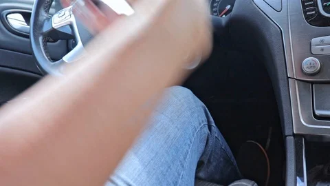 A driver inserts the key and starts the engine Engine start key hole, ignition Stock Footage 117939669