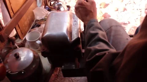 The driver of a large mountain excavator, loads the soil. The view from the Video stock 122214503