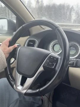 Driver with Limited Finger Functionality Operating a Vehicle Stock Photos