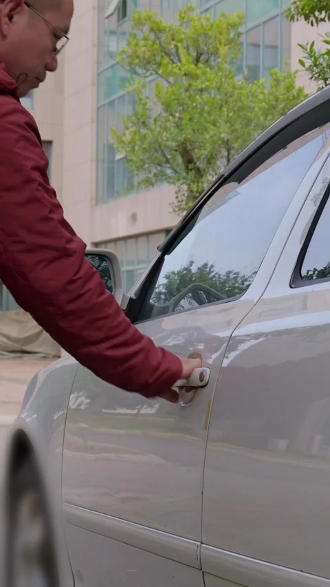 The driver locked himself out after forgetting his keys. Stock Footage 329397611