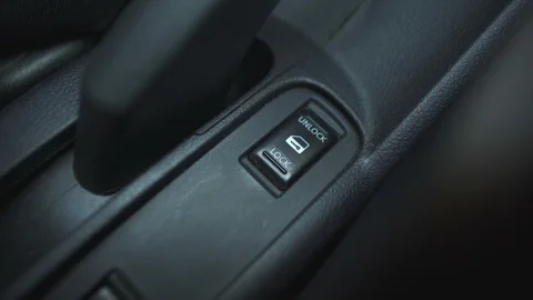 Driver is locking all doors from the inside the car Stock Footage 99907160