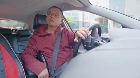 The driver looks back from different angles while reversing. Stock Footage 329165431