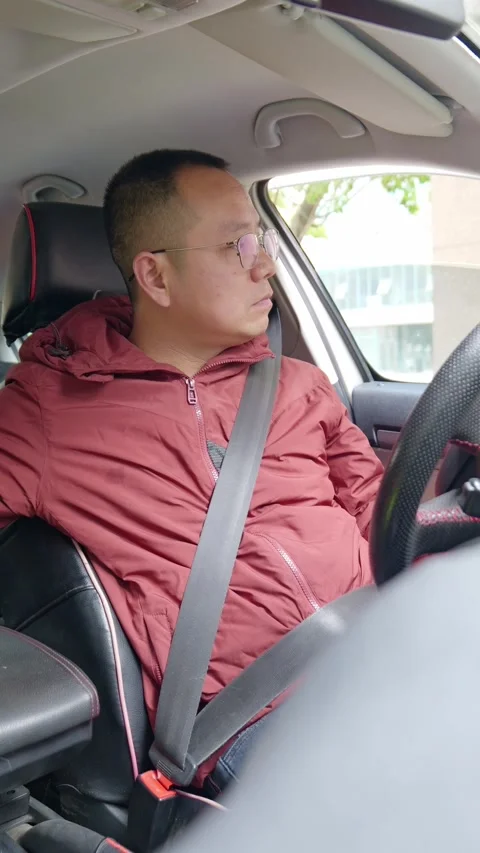 The driver looks back from different angles while reversing. Stock Footage 329397127