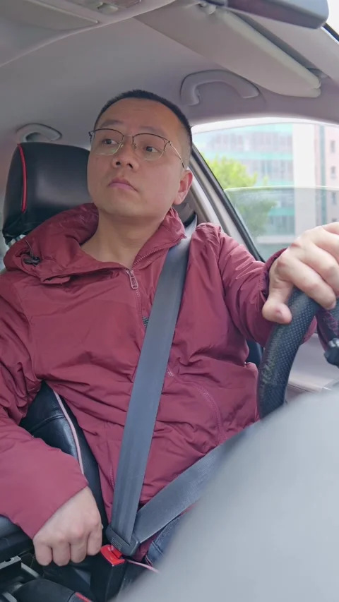 The driver looks back from different angles while reversing. Stock Footage 329397489