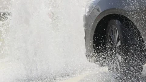 Driver lost control of the car on the slippery road surface of driving course Stock Footage 283285883