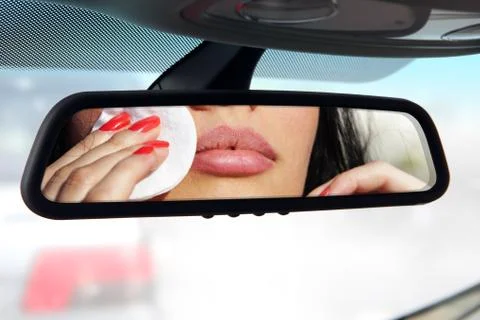 Driver make a makeup in car Stock Photos