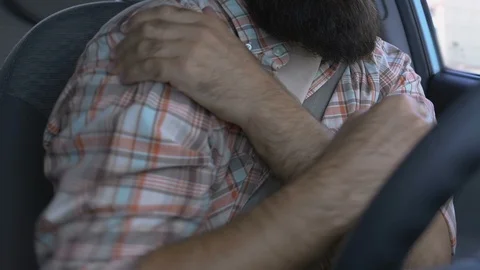 Driver making exercise in car to relieve shoulder pain, joint inflammation 動画素材 117222626