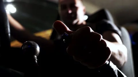 Driver man controls auto and use hand brakes. Footage. Close up of uses a manual Stockbeeldmateriaal 131029174