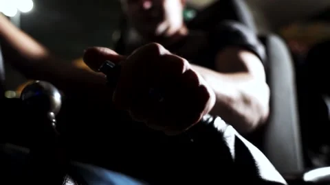 Driver man controls auto and use hand brakes. Footage. Close up of uses a manual Stock Footage 131029206