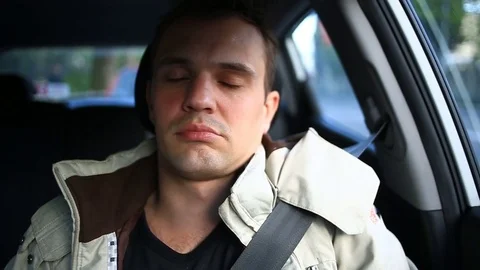 Driver of the man fell asleep in the driver's seat on the side of the busy road Stock Footage 74750269