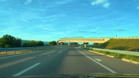 Driver moves along highway under clear sky. Serbia Stock Footage 340638788