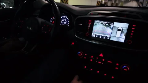 Driver moves on car backward by underground garage and rear view shown at Stock Footage 276370577