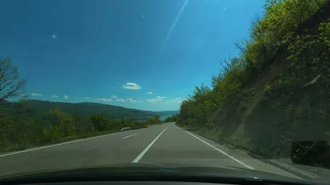 Driver moves forward on paved highway. Balkan, Eastern Europe, POV Video stock 333344804